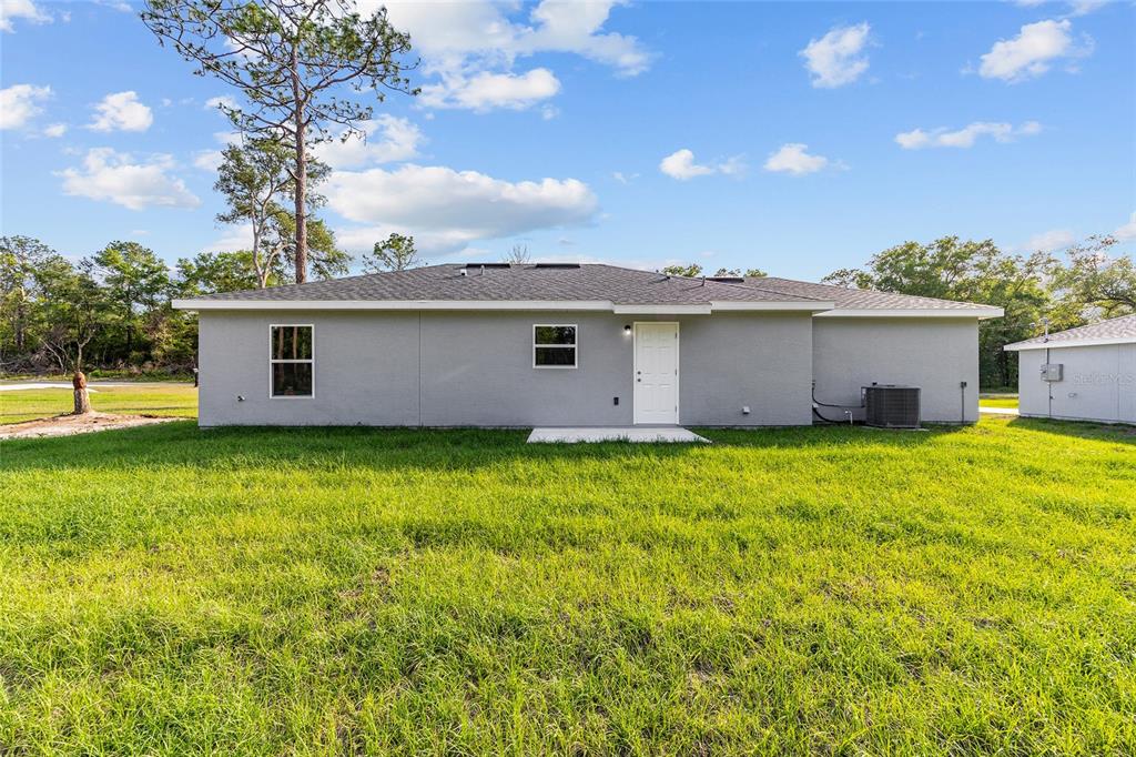 360 Locust Road Ocala, FL 34472 - Photo 8 of 48 a view of a house with backyard and garden