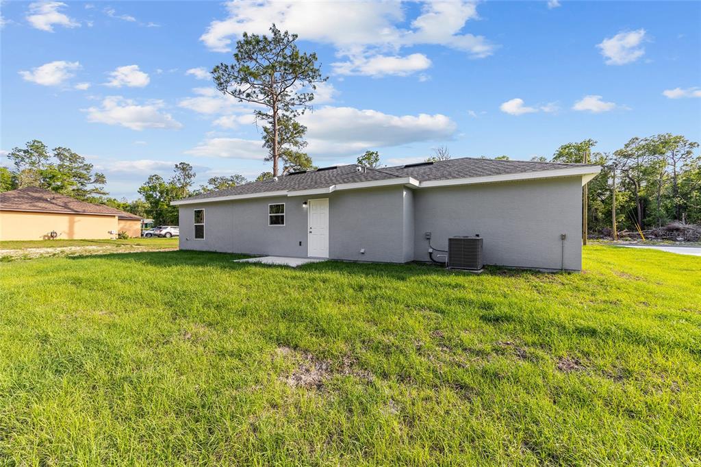 360 Locust Road Ocala, FL 34472 - Photo 9 of 48 a view of a backyard with garden