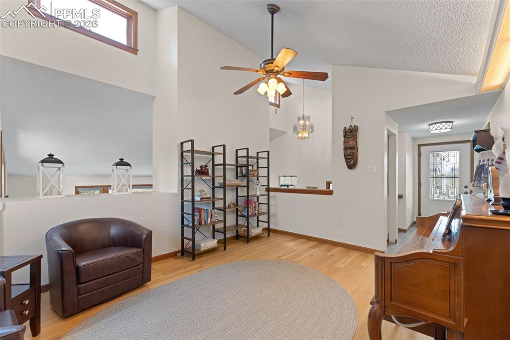 1851 Buttercup Road Elizabeth, CO 80107 - Photo 11 of 47 a bedroom with furniture and a chandelier
