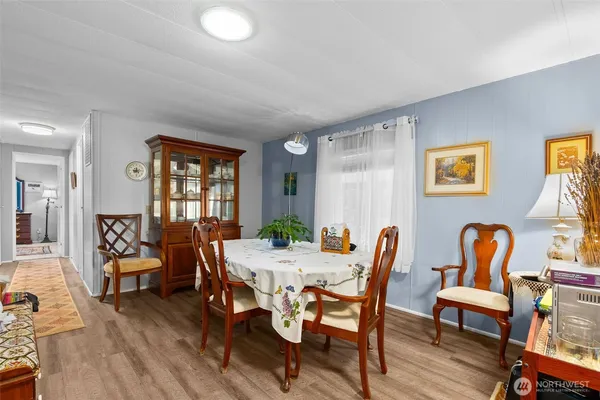 a view of a dining room with furniture window and wooden floor