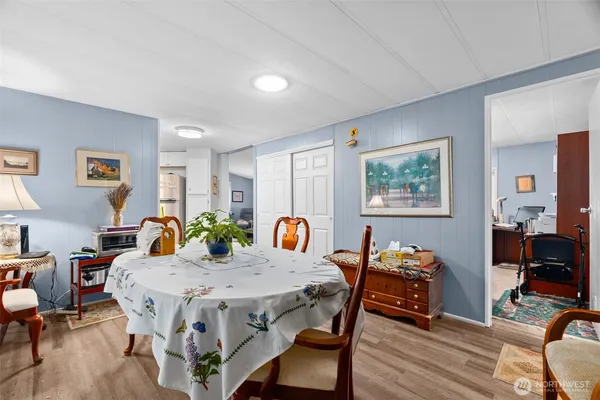 a view of a dining room with furniture and wooden floor