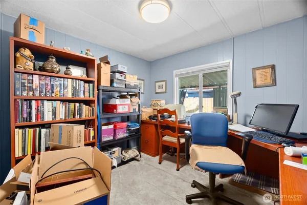 a bedroom with furniture and a book shelf