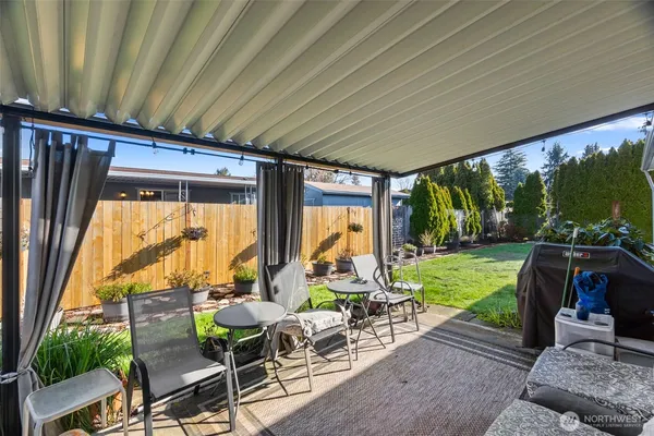 a view of living room with patio furniture and garden