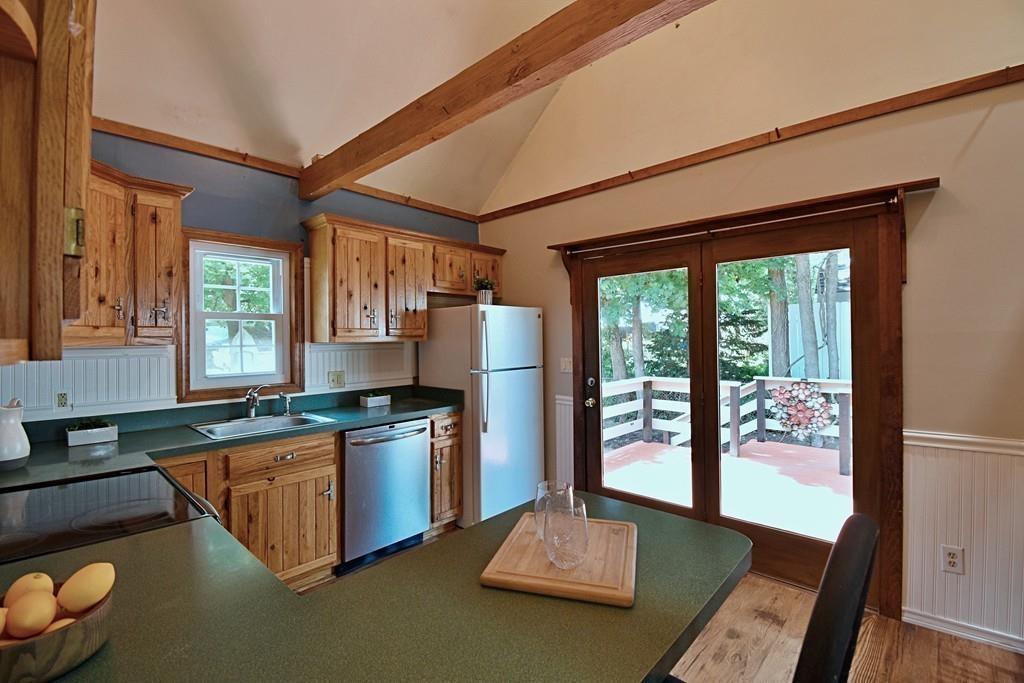 16 Emeline Road Weymouth, MA 02189 - Photo 12 of 40 a kitchen with stainless steel appliances granite countertop a refrigerator a stove and a sink with granite countertops