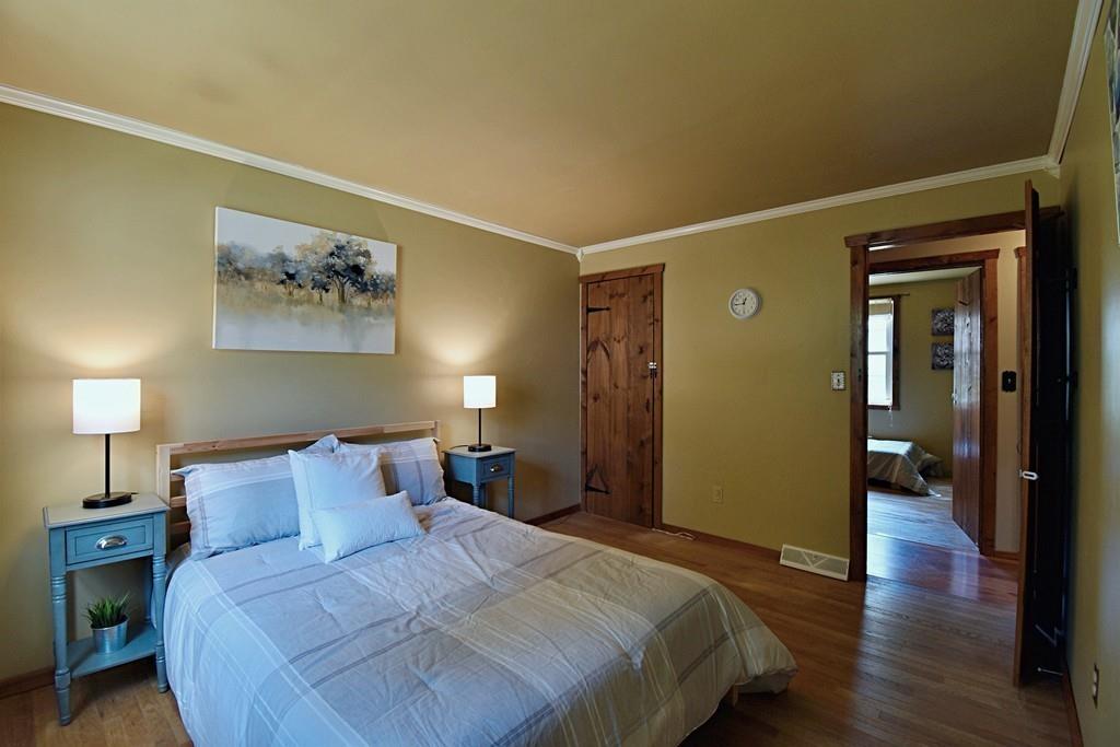 16 Emeline Road Weymouth, MA 02189 - Photo 16 of 40 a bedroom with a bed and a painting on the wall