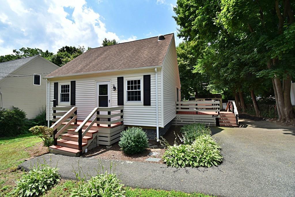 16 Emeline Road Weymouth, MA 02189 - Photo 2 of 40 a wooden bench sitting in front of a house