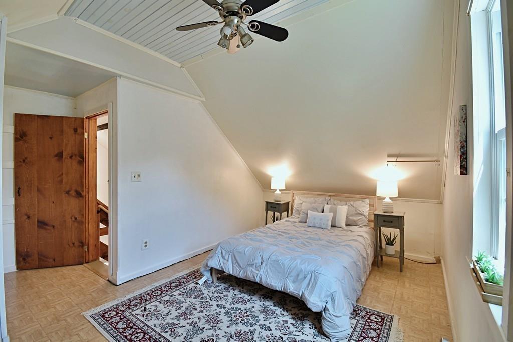 16 Emeline Road Weymouth, MA 02189 - Photo 25 of 40 a bedroom with a bed and a chandelier