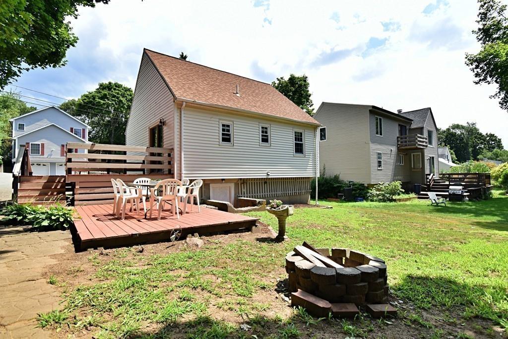 16 Emeline Road Weymouth, MA 02189 - Photo 39 of 40 a view of a backyard with plants and a patio