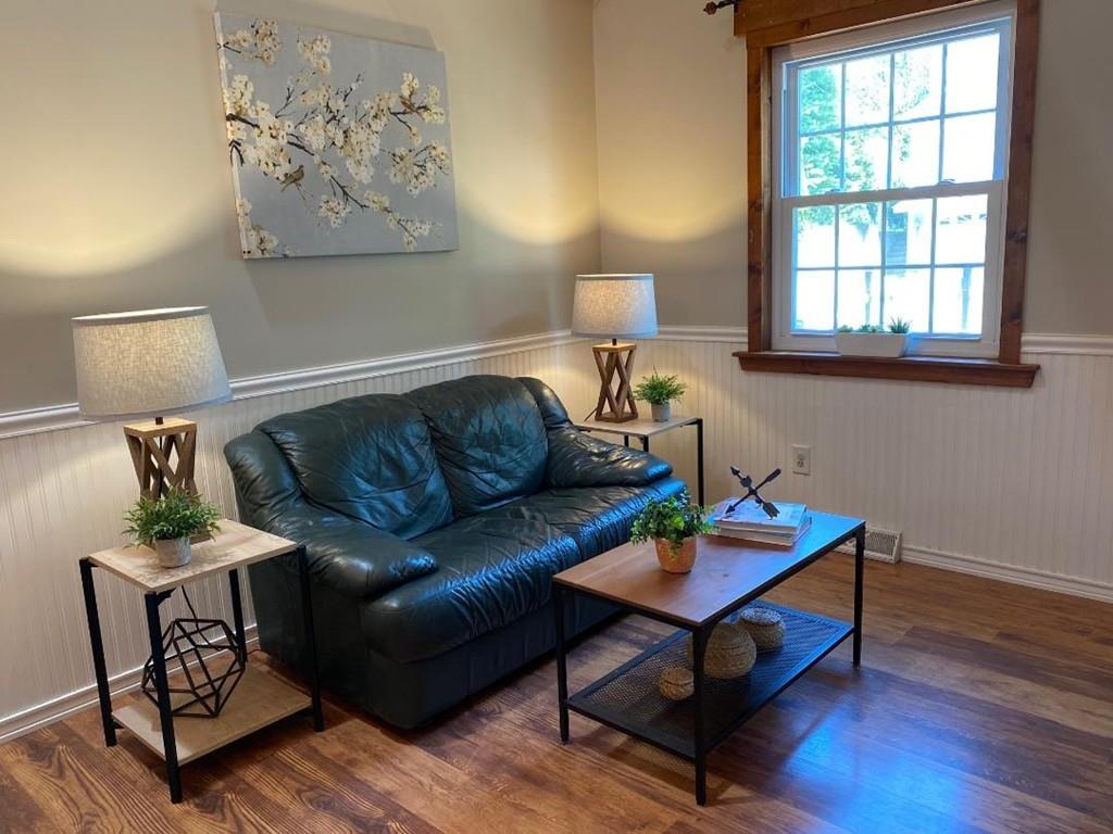 16 Emeline Road Weymouth, MA 02189 - Photo 7 of 40 a living room with furniture a window and a lamp