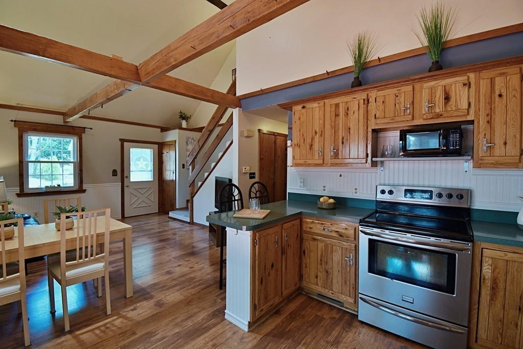 16 Emeline Road Weymouth, MA 02189 - Photo 9 of 40 a kitchen with stainless steel appliances kitchen island a stove and a wooden floors