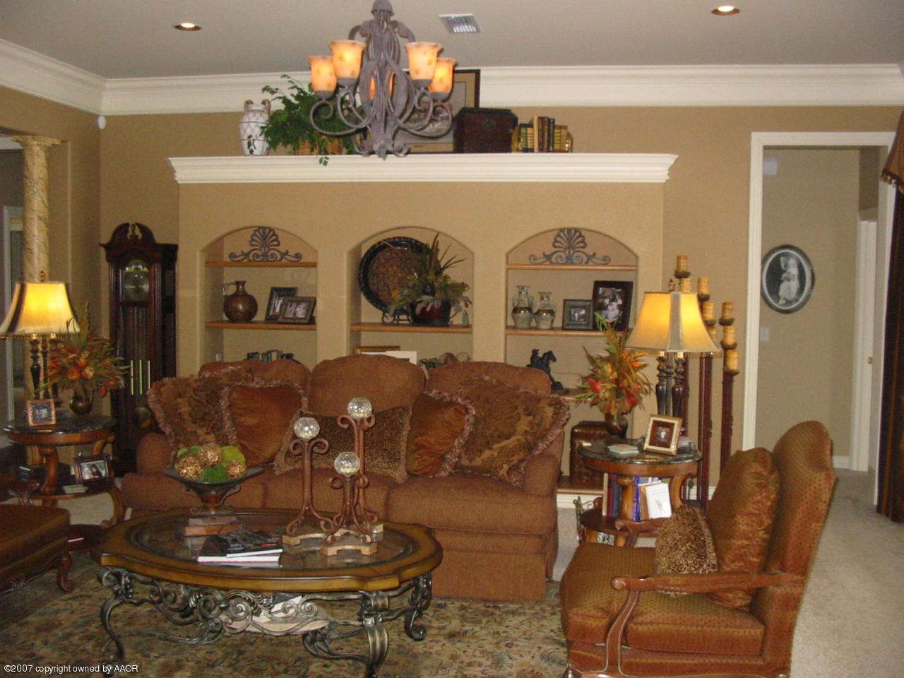 8900 Blackhawk Road Amarillo, TX 79119 - Photo 4 of 13 a living room with furniture and a fireplace