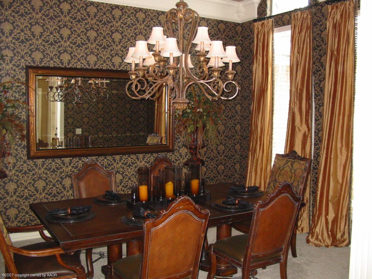 8900 Blackhawk Road Amarillo, TX 79119 - Photo 5 of 13 a view of a dining room with furniture and chandelier