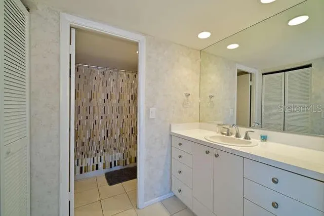 a bathroom with a double vanity sink and mirror