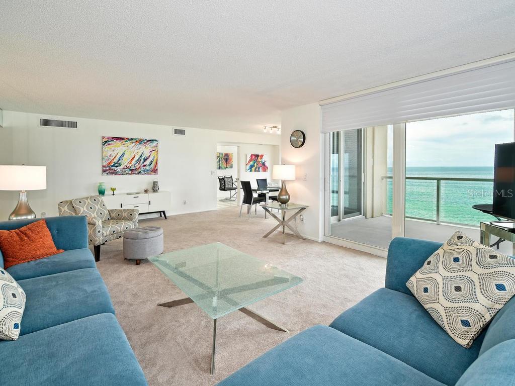 2425 Gulf Of Mexico Drive, Unit 7F Longboat Key, FL 34228 - Photo 20 of 50 a living room with furniture and a large window