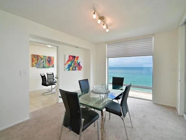 a dining room with furniture and window