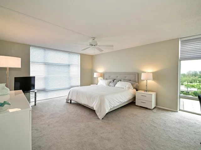 a bedroom with bed and window
