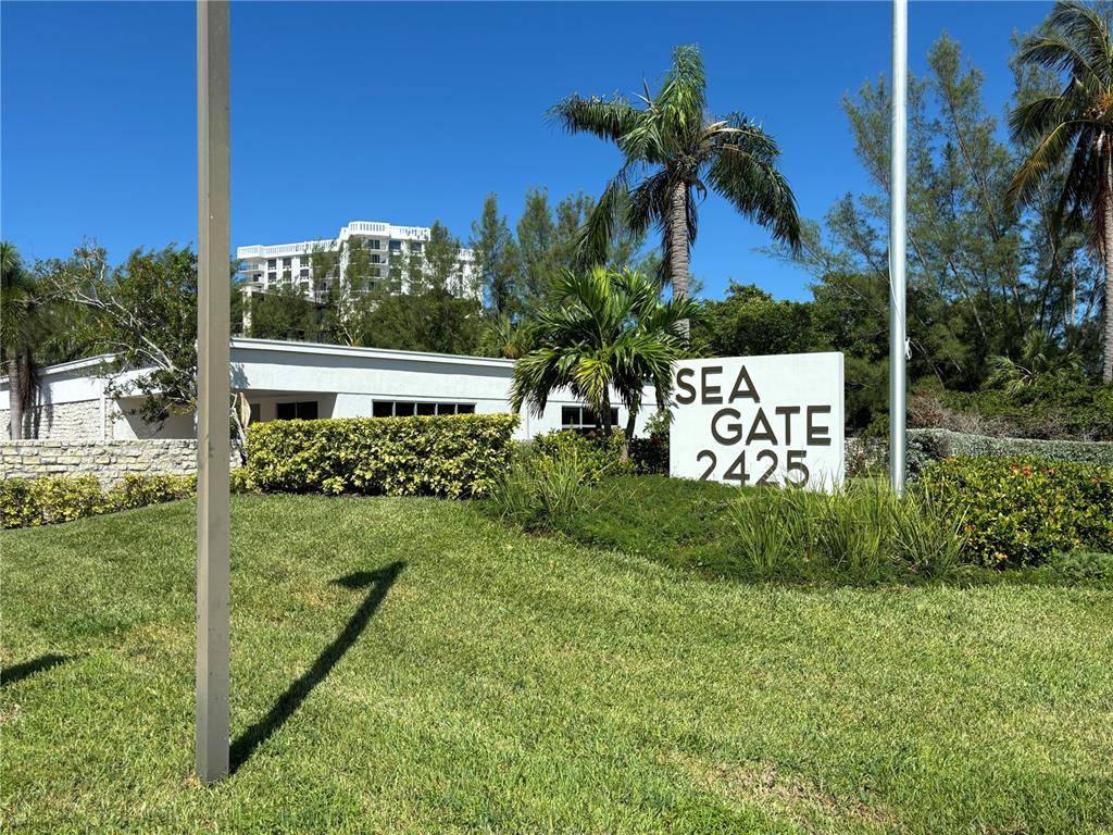 2425 Gulf Of Mexico Drive, Unit 7F Longboat Key, FL 34228 - Photo 50 of 50 a view of a sign in a yard with potted plants