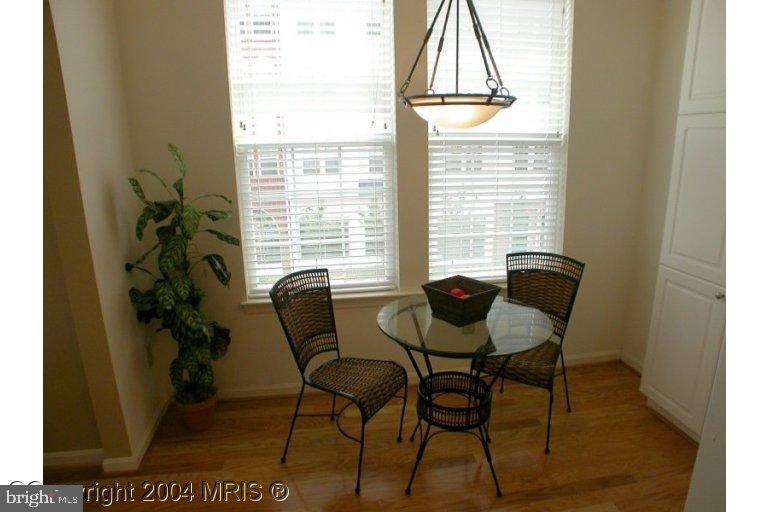a view of a dining room with furniture and a window