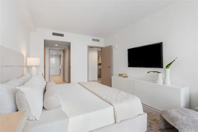 a bathroom with a shower and a glass door