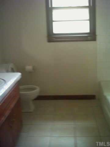 3342 Ebenezer Church Road Benson, NC 27504 - Photo 5 of 8 a bathroom with a toilet