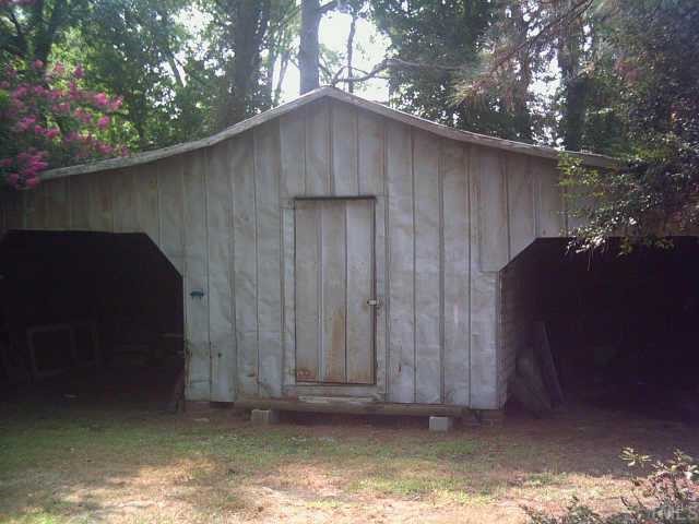 3342 Ebenezer Church Road Benson, NC 27504 - Photo 7 of 8 a wooden door in front of a house