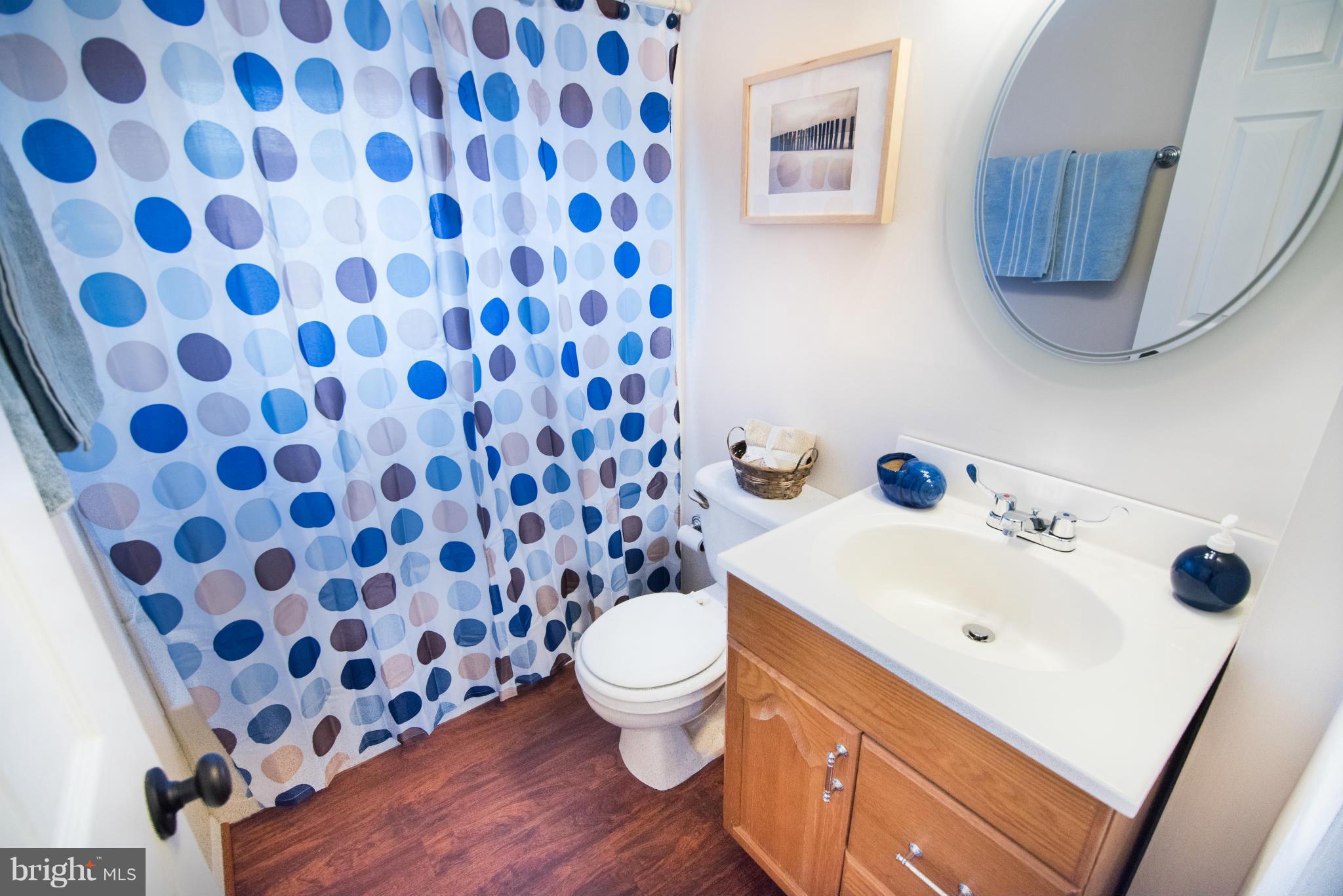 604 Queensgate Road Baltimore, MD 21229 - Photo 14 of 22 a bathroom with a sink and a toilet