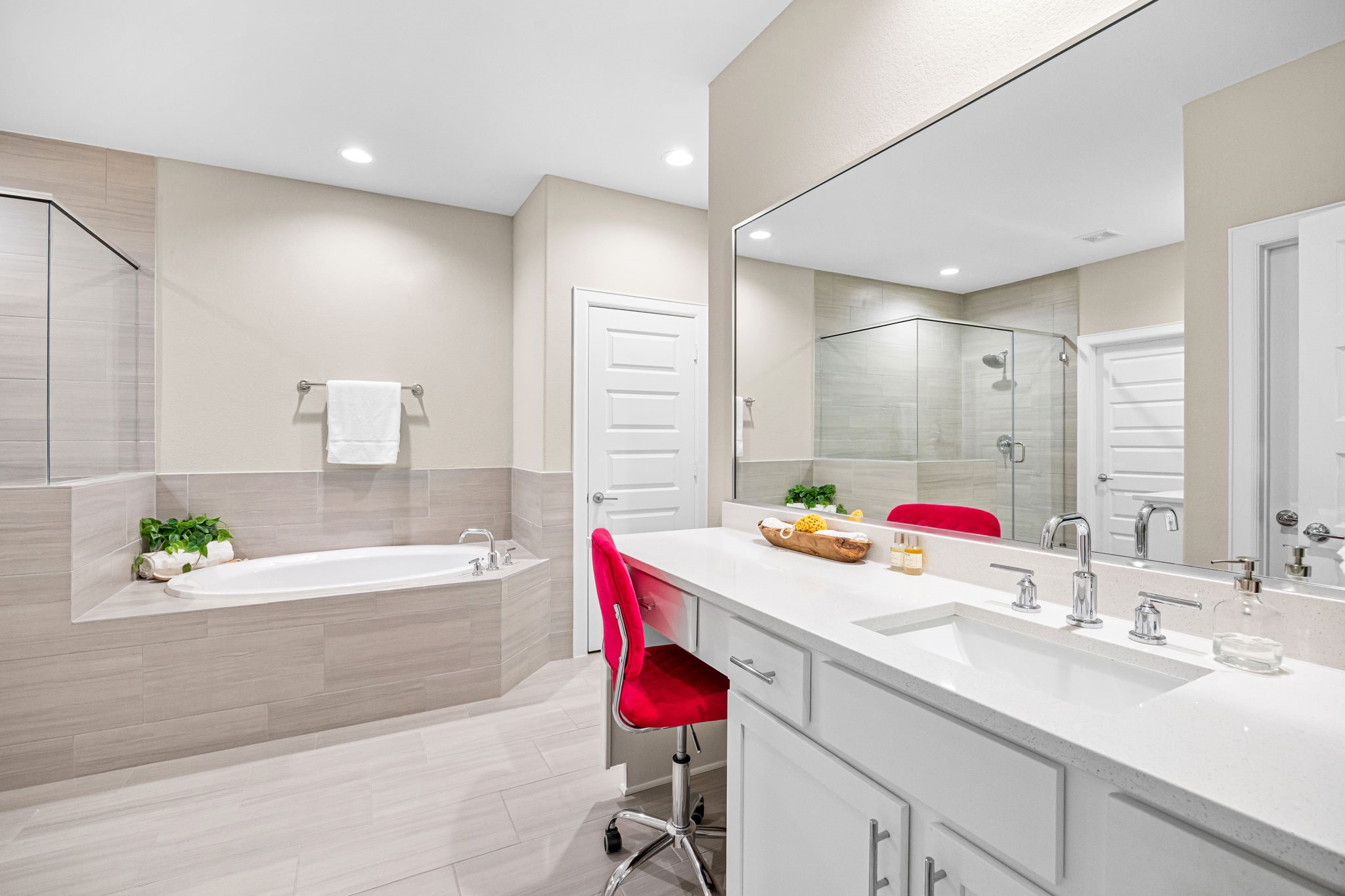 1732 Wichita Street Houston, TX 77004 - Photo 18 of 35 Bright vanity area with quartz countertops, under-mount sink, oversized mirror, and dedicated seated makeup vanity space.