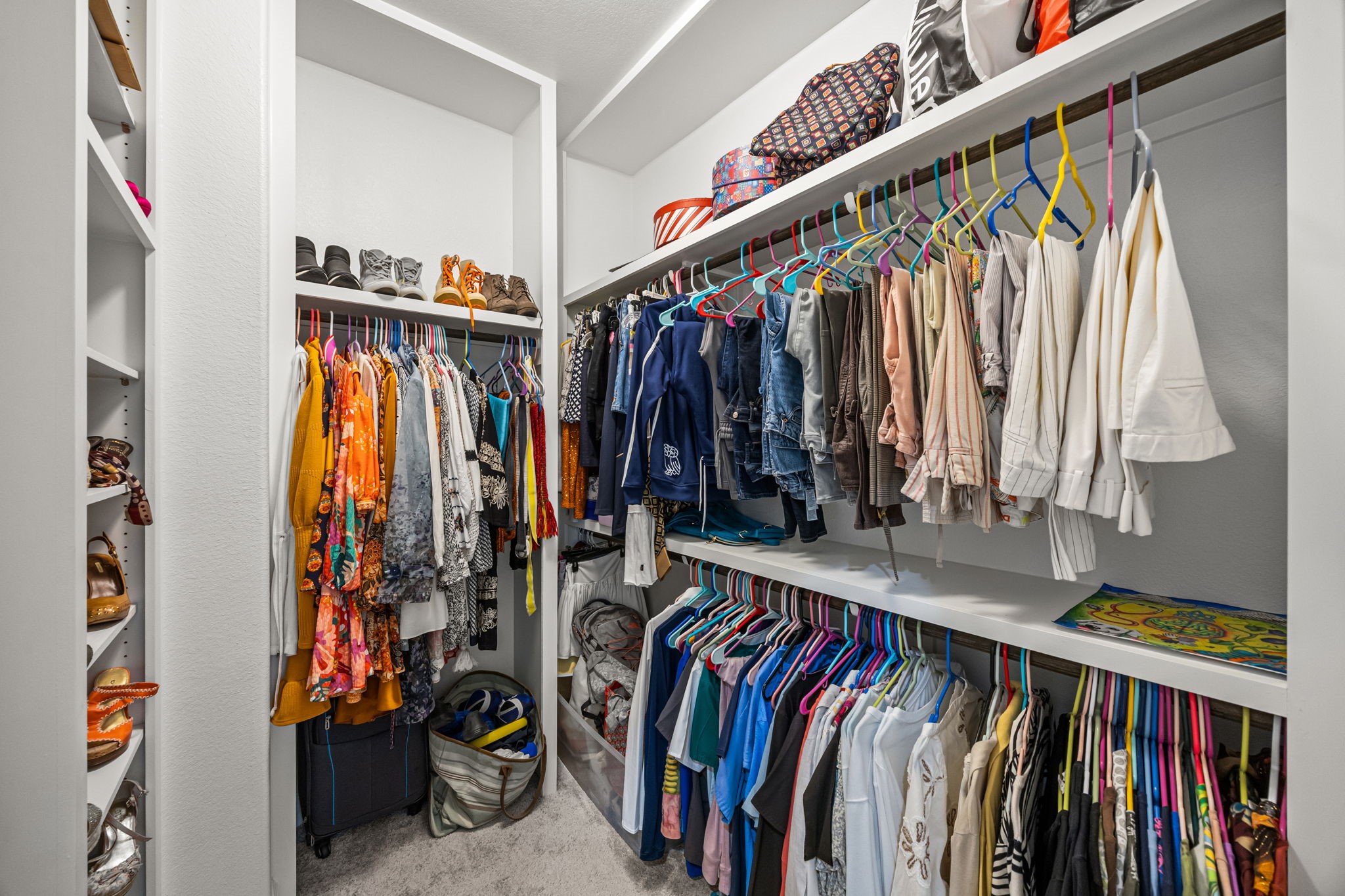 1732 Wichita Street Houston, TX 77004 - Photo 23 of 35 2 of 2 Expansive custom walk-in closets with built-in shelving, hanging space, and organization throughout.