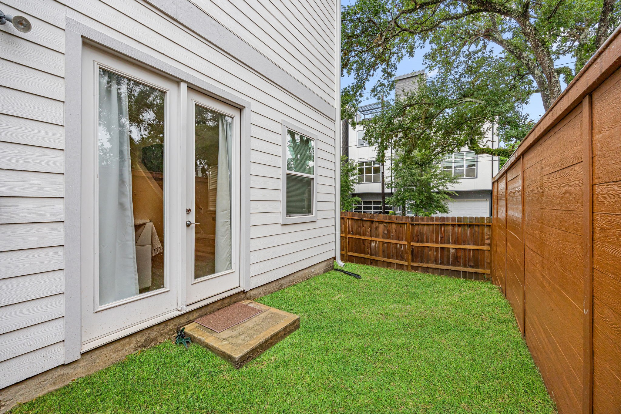 1732 Wichita Street Houston, TX 77004 - Photo 30 of 35 Cozy outdoor area with direct access from the living space and room for seating or grilling.