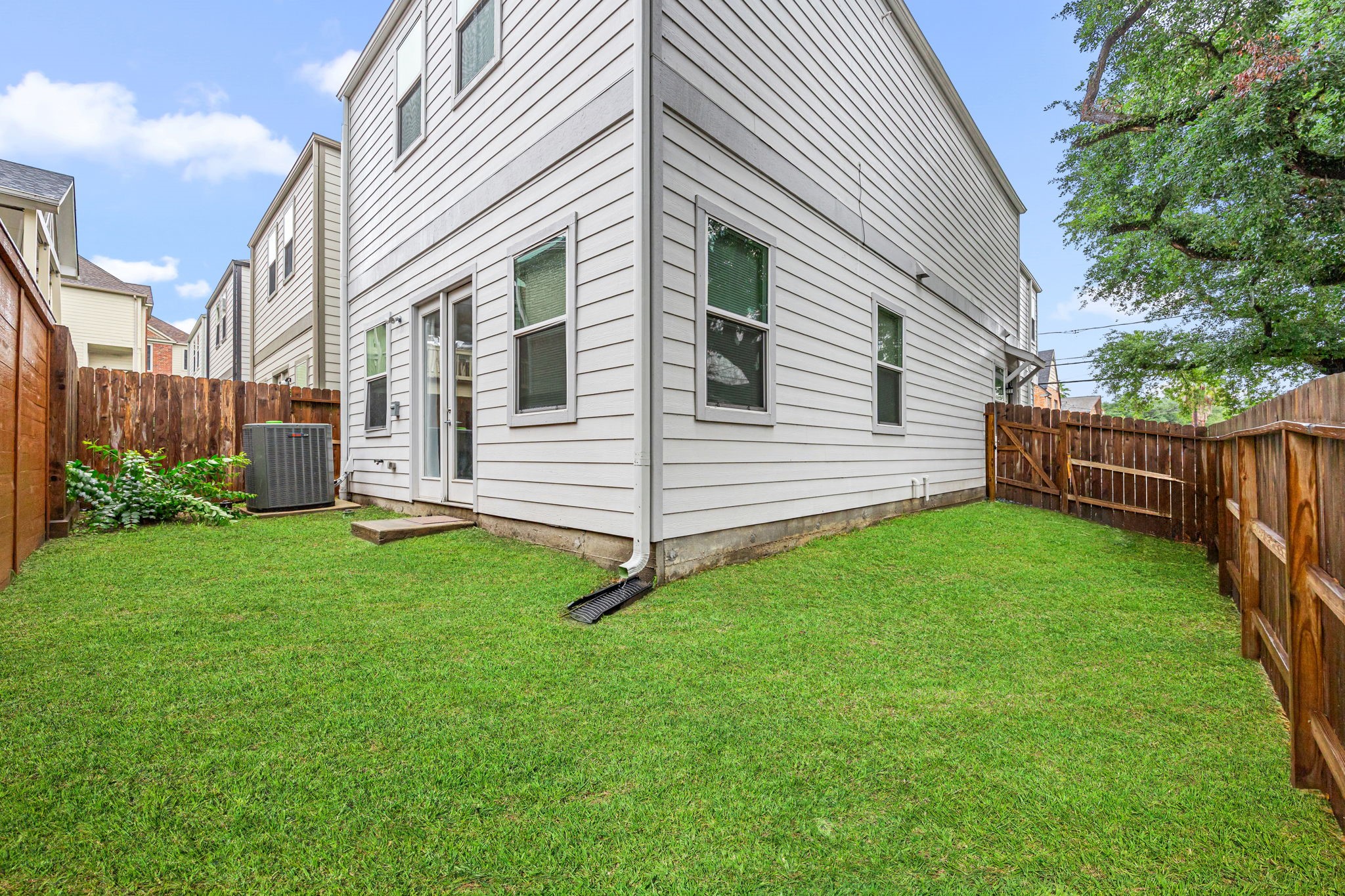 1732 Wichita Street Houston, TX 77004 - Photo 31 of 35 Private fenced backyard with green space perfect for relaxing, entertaining, or pets to enjoy.