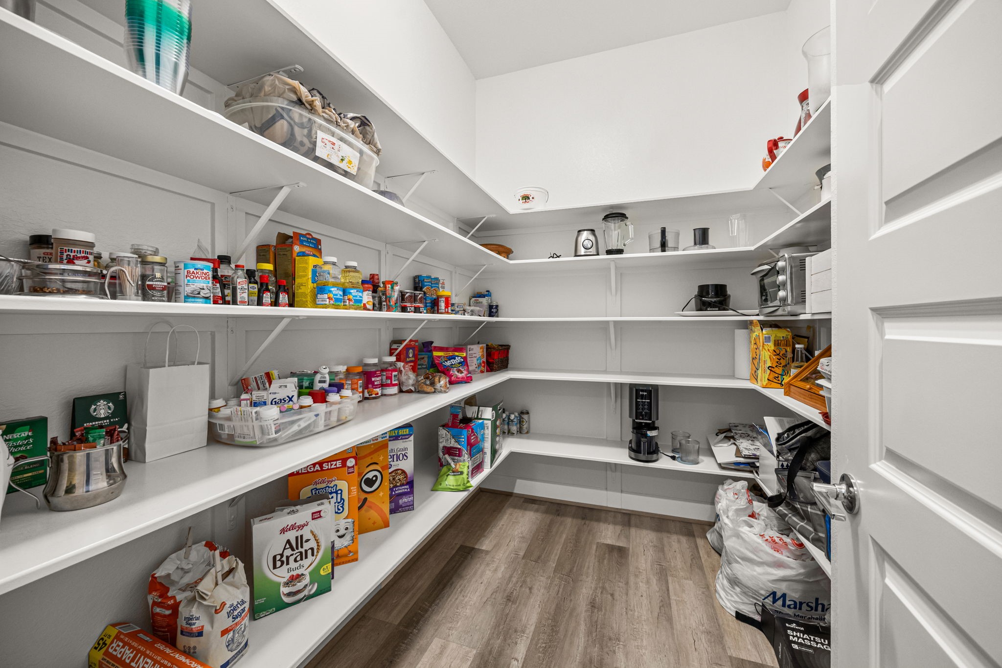1732 Wichita Street Houston, TX 77004 - Photo 6 of 35 Oversized walk-in pantry with extensive built-in shelving offering exceptional storage and organization space.