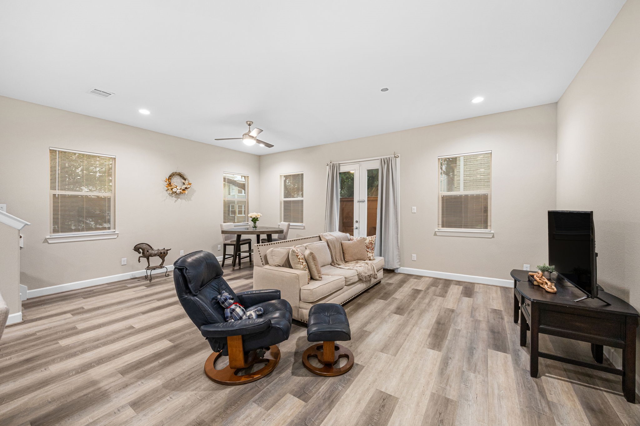 1732 Wichita Street Houston, TX 77004 - Photo 10 of 35 Wide open living room layout with modern finishes, oversized windows, and flexible space for multiple seating arrangements.