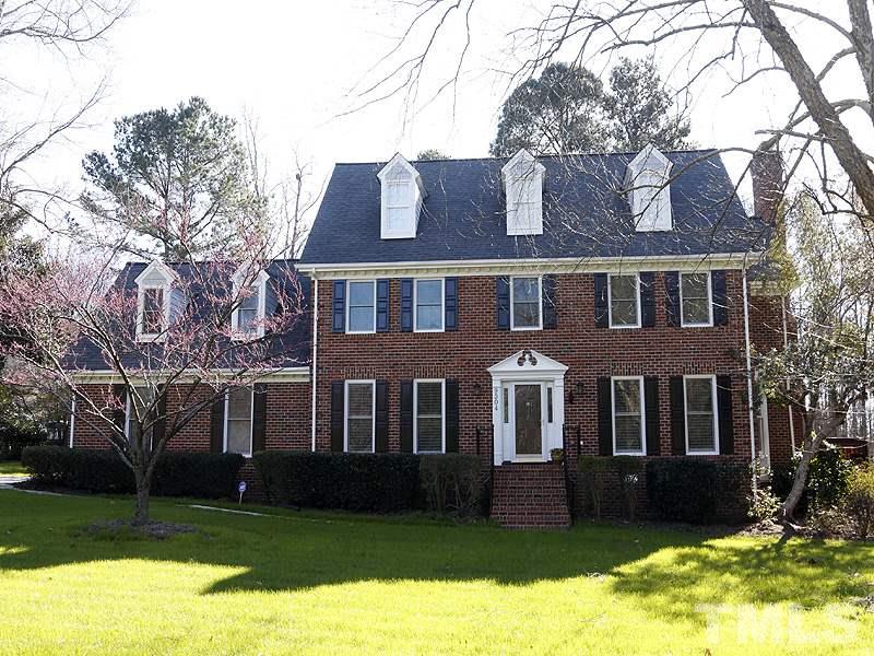 9304 Litchford Road Raleigh, NC 27615 - Photo 1 of 25 front view of a brick house with a yard