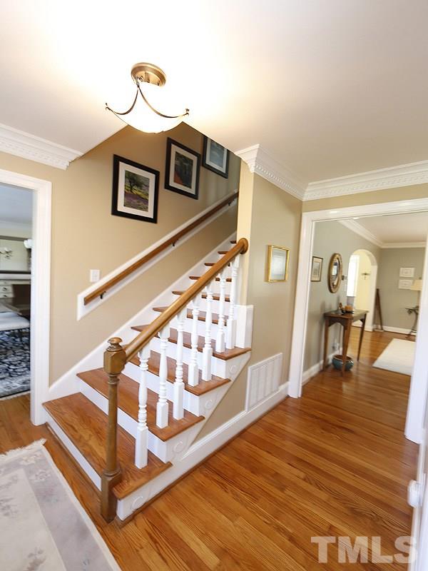9304 Litchford Road Raleigh, NC 27615 - Photo 3 of 25 a living room with wooden floor and furniture