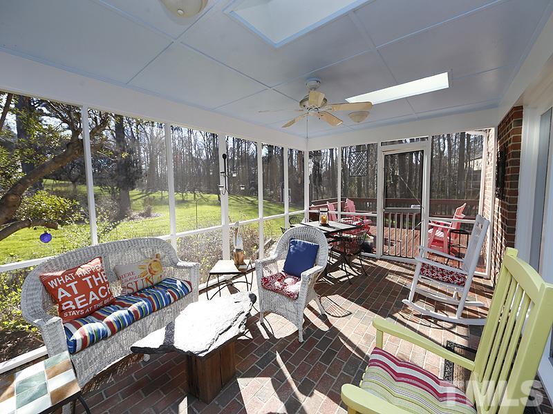 9304 Litchford Road Raleigh, NC 27615 - Photo 22 of 25 a view of a patio with couches chairs dining table and chairs