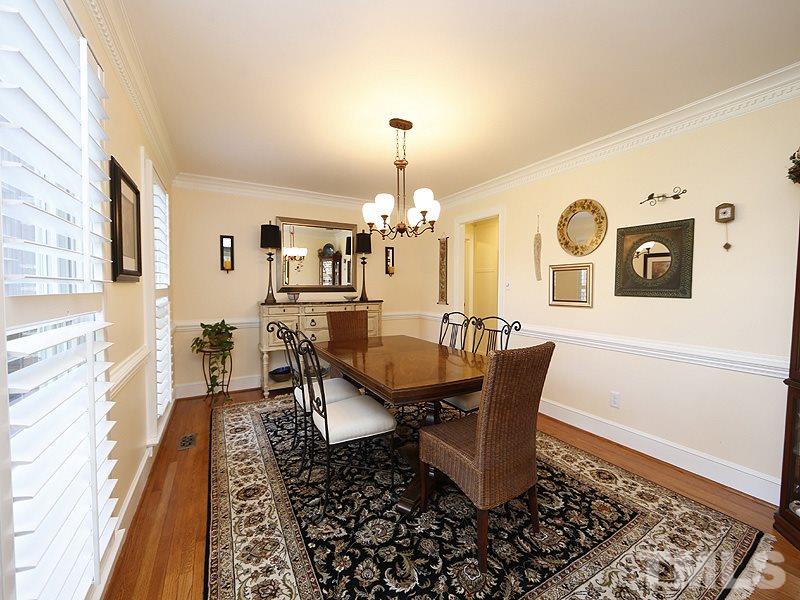 9304 Litchford Road Raleigh, NC 27615 - Photo 4 of 25 a dining room with furniture and chandelier