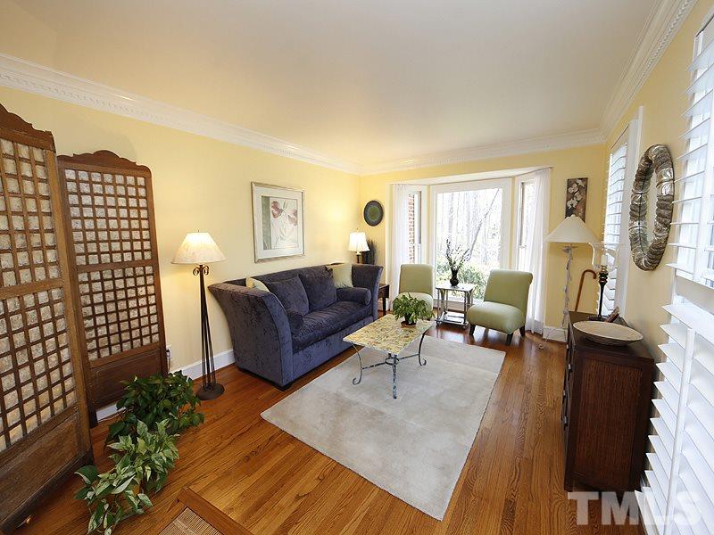 9304 Litchford Road Raleigh, NC 27615 - Photo 5 of 25 a living room with furniture and a fireplace