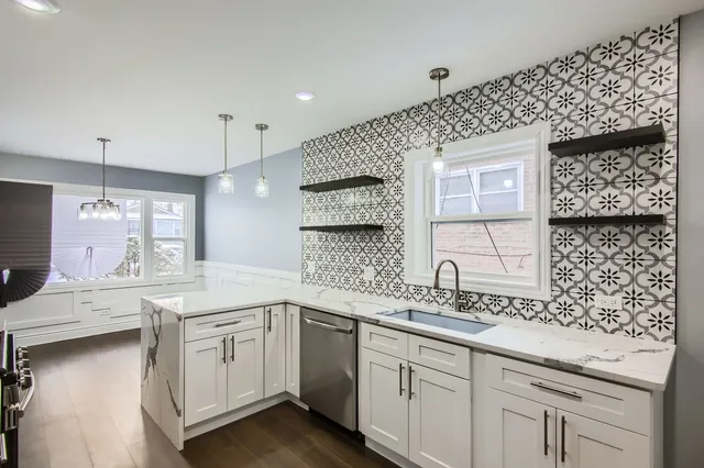 a kitchen with a sink stove and cabinets