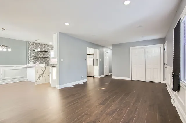 a view of a kitchen with wooden floor