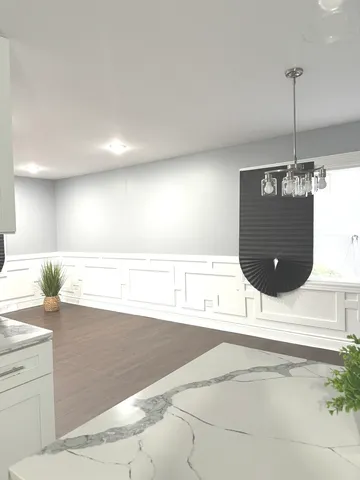 a view of a living room and kitchen