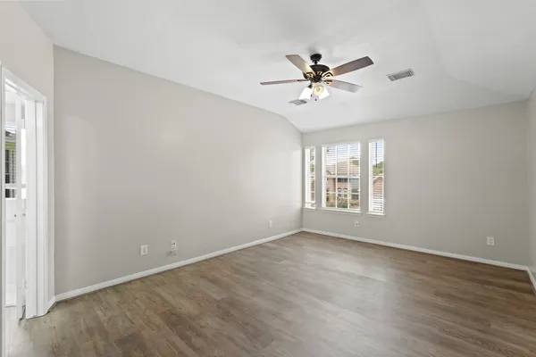 a view of an empty room with a window