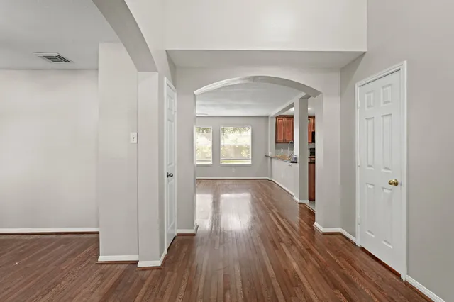 a view of livingroom with hardwood floor and hallway