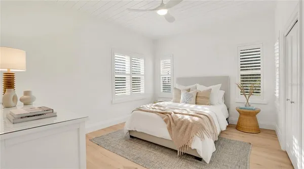 a bedroom with bed and a night stand