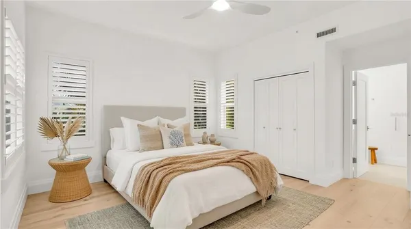 a bedroom with a bed and a couch