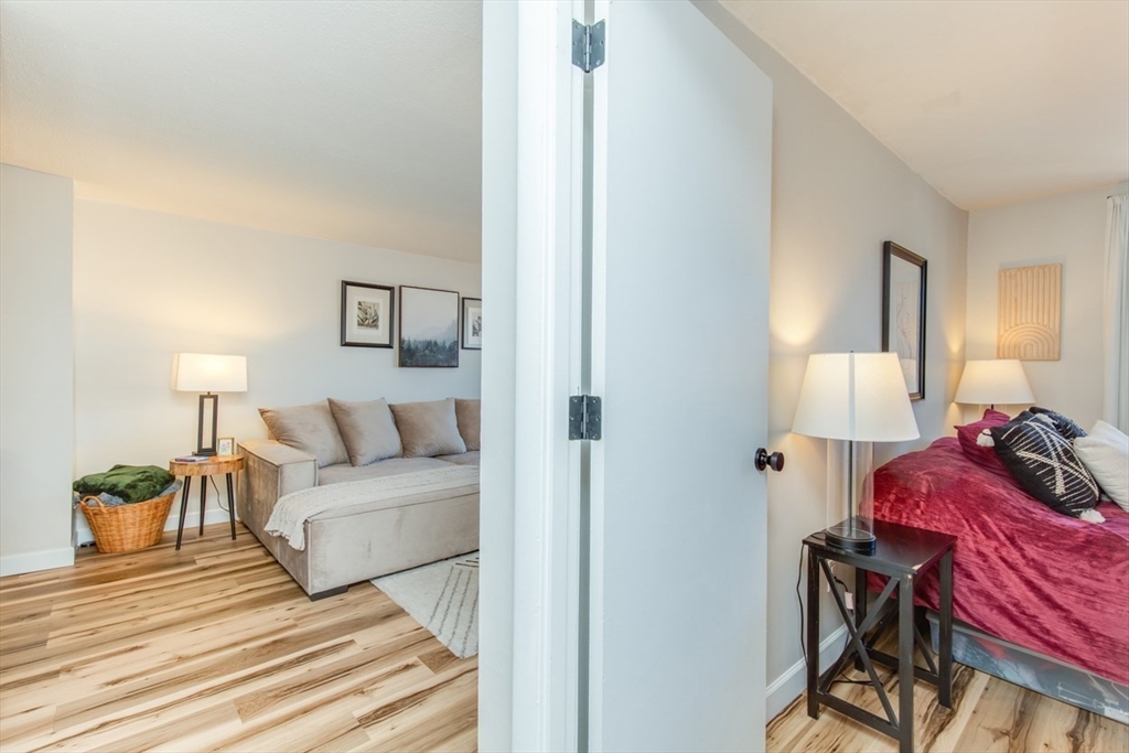 15 Staples Avenue, Unit 46 Everett, MA 02149 - Photo 17 of 35 a bedroom with a bed and a lamp