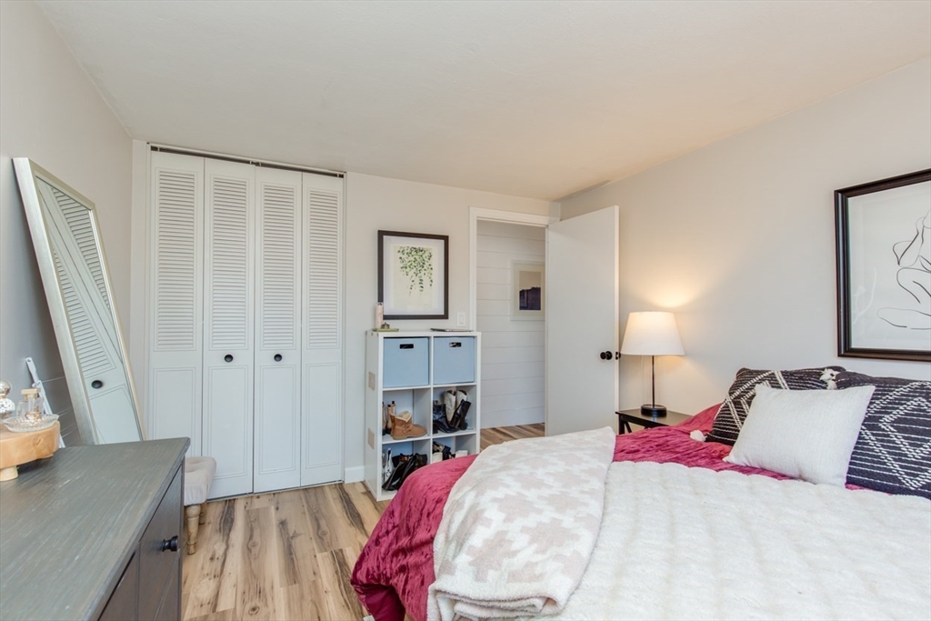 15 Staples Avenue, Unit 46 Everett, MA 02149 - Photo 21 of 35 a bed room with a bed and a couch