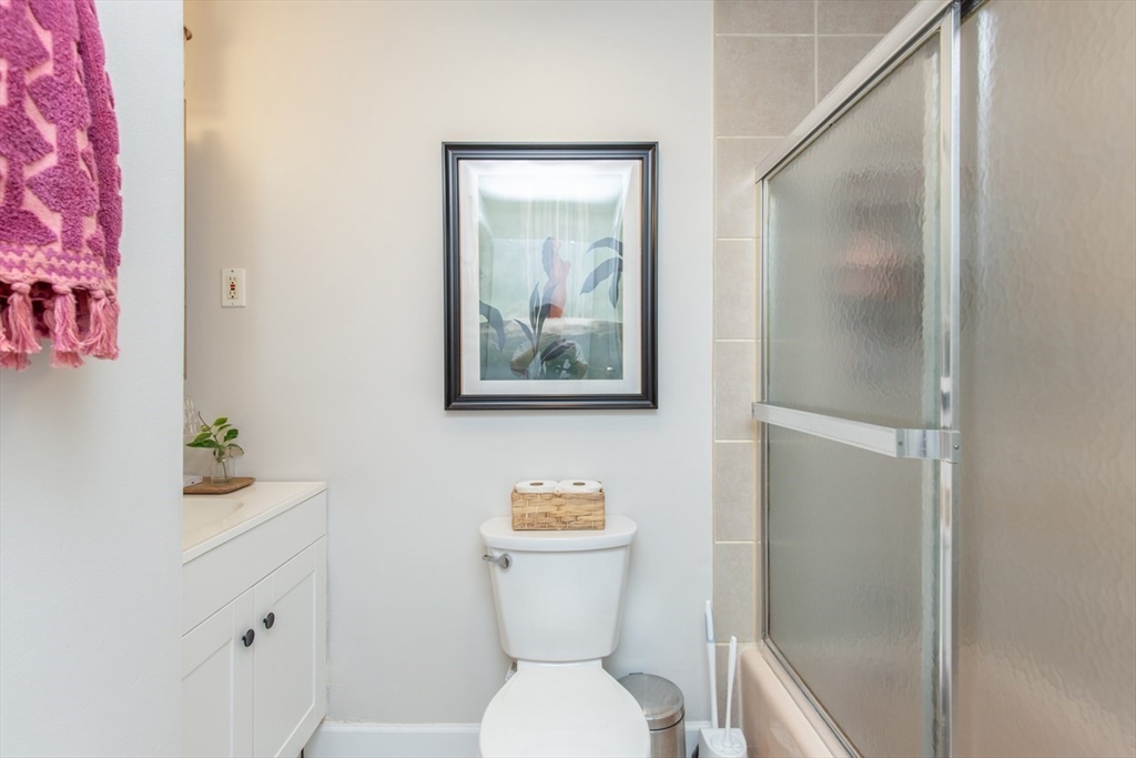 15 Staples Avenue, Unit 46 Everett, MA 02149 - Photo 25 of 35 a white toilet sitting next to a bathroom sink