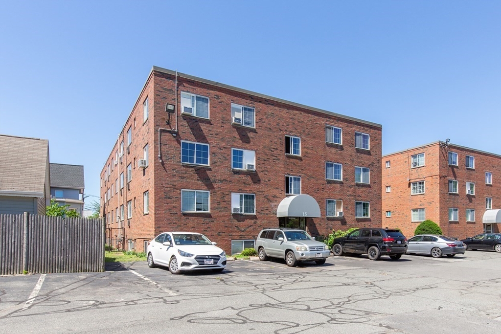 15 Staples Avenue, Unit 46 Everett, MA 02149 - Photo 29 of 35 a car parked in front of a building