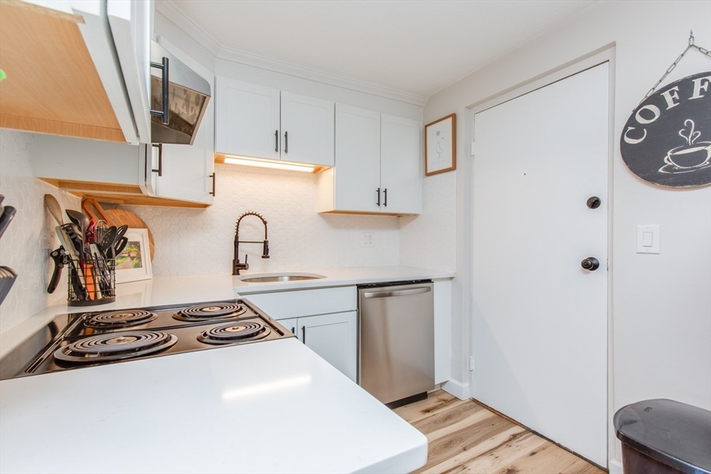 15 Staples Avenue, Unit 46 Everett, MA 02149 - Photo 3 of 35 a kitchen with a stove and a refrigerator