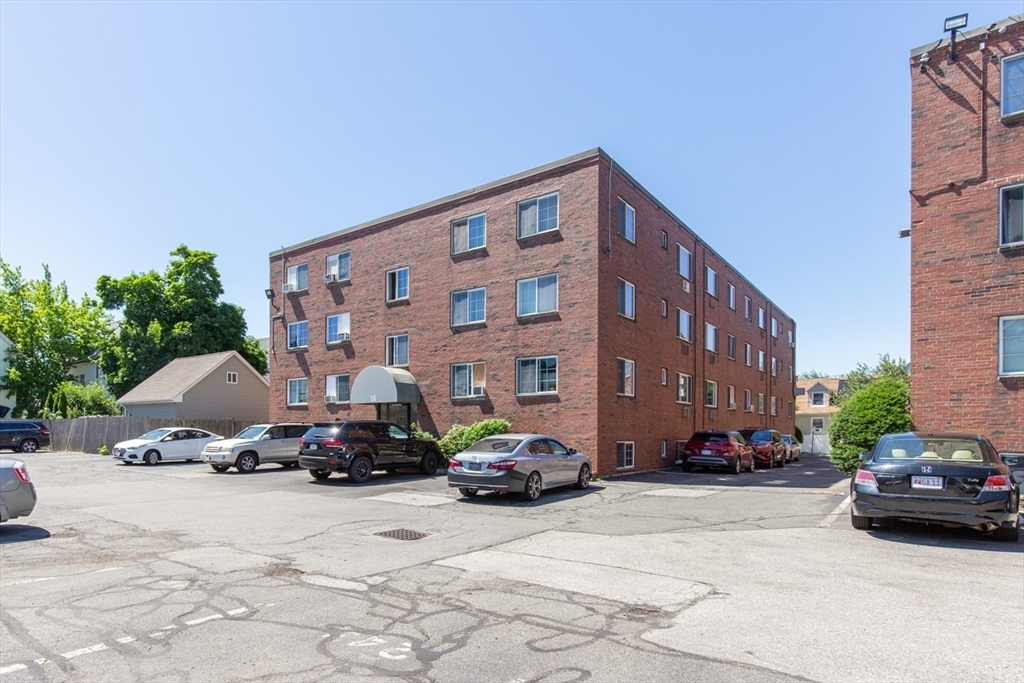 15 Staples Avenue, Unit 46 Everett, MA 02149 - Photo 31 of 35 a car parked in front of a building